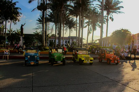 Jeep Willys parked on the square at sunset